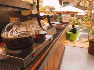 a coffee maker on a counter in a restaurant at Bali Wirasana Inn in Sanur