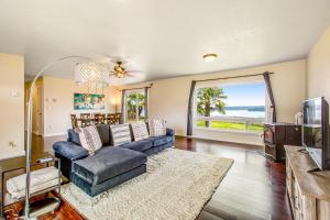 a living room with a couch and a tv at Keyport Abode in Poulsbo