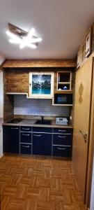Kuchyň nebo kuchyňský kout v ubytování Appartement Gassner