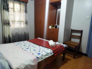 Ein Bett oder Betten in einem Zimmer der Unterkunft Half Acre Compound 1 Bedroom Residential Home