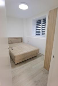 Postel nebo postele na pokoji v ubytování KRAGUJ apartman 2