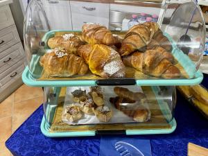 
a tray filled with different types of baked goods at L'Oasi di Chia in Chia

