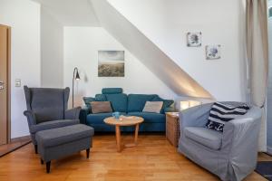 Posezení v ubytování Ferienwohnung Nr 5 am Weststrand - 4 Sterne DTV