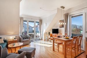 Posezení v ubytování Ferienwohnung Nr 5 am Weststrand - 4 Sterne DTV