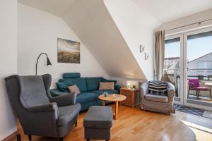 Posezení v ubytování Ferienwohnung Nr 5 am Weststrand - 4 Sterne DTV