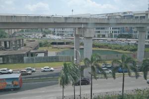 a highway with a bridge and cars on the road at Summer Oscar Boutique Hotel in Subang Jaya