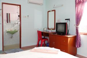 Televisyen dan/atau pusat hiburan di The Room Concept Homestay