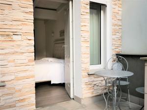 Postel nebo postele na pokoji v ubytování Hotel Patavium