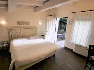 Postel nebo postele na pokoji v ubytování Hotel Patavium