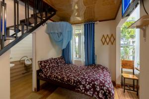 Postel nebo postele na pokoji v ubytování Homestay Vườn Tùng