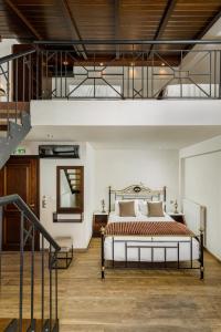 Ένα ή περισσότερα κρεβάτια σε δωμάτιο στο Arxontariki Suites