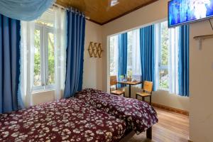 Postel nebo postele na pokoji v ubytování Homestay Vườn Tùng