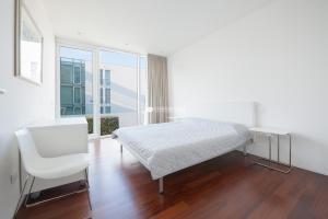 A bed or beds in a room at Jesolo Lido Village Immobiliare Pacella Még 10 kép
