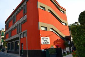 a orange building with a sign on the side of it at Hotel Sereno in Sestri Levante