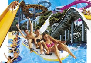 a group of people on a water slide at a water park at DANIEL in Saint-Cyr-sur-Mer