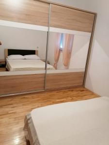Postel nebo postele na pokoji v ubytování Apartments Seven Castles P
