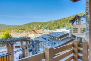 a view from the balcony of a building with a roof at Snow Star Sanctuary in Olympic Valley