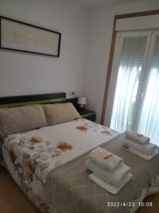 Ліжко або ліжка в номері apartamento melide