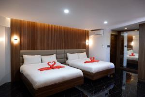 Postel nebo postele na pokoji v ubytování El Vistra Traveller's Inn