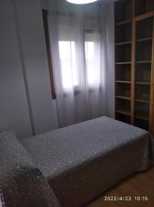 Posteľ alebo postele v izbe v ubytovaní apartamento melide