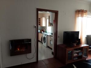 TV a/nebo společenská místnost v ubytování Machico Beach Comfort