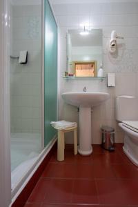 a bathroom with a sink and a shower at Hotel Valpolicella International in San Pietro in Cariano