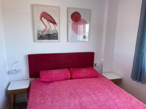 Łóżko lub łóżka w pokoju w obiekcie Apartamento edificio Goya