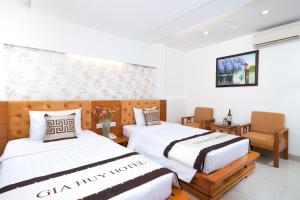 Postel nebo postele na pokoji v ubytování Gia Huy Hotel