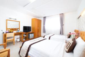 TV a/nebo společenská místnost v ubytování Gia Huy Hotel