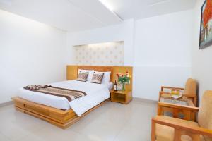 Postel nebo postele na pokoji v ubytování Gia Huy Hotel