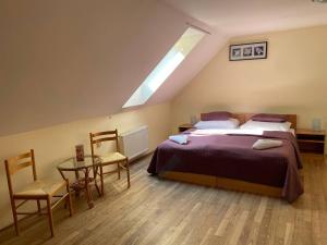 Postel nebo postele na pokoji v ubytování Hotel STARÝ PIVOVAR
