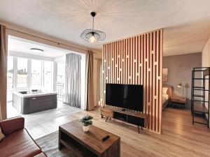 Televízia a/alebo spoločenská miestnosť v ubytovaní Apartments Viskovic