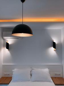 A bed or beds in a room at Amber Boutique Hotel