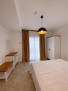 A bed or beds in a room at Amber Boutique Hotel
