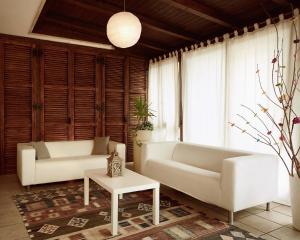 a living room with two white couches and a table at Soul House in Civitanova Marche