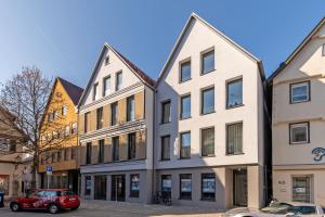 a row of buildings on a street at WEST Apartments in Schorndorf