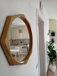 a mirror hanging on a wall in a kitchen at HOUSE PIAZZA VITTORIA in Medole +13 photos