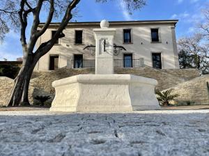 a large statue in front of a building at Bastide Beaudinard in Aubagne