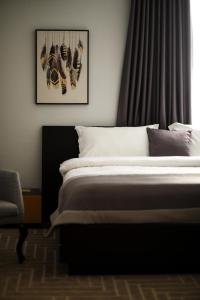 Postel nebo postele na pokoji v ubytování Triss Hotel