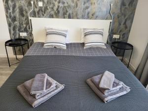 Postel nebo postele na pokoji v ubytování Apartmani Karlo