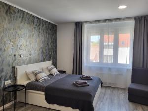 Postel nebo postele na pokoji v ubytování Apartmani Karlo