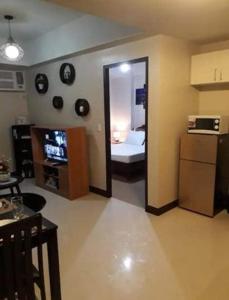 TV i/ili multimedijalni sistem u objektu Cubao ManhattanHeights Unit 23D Tower C, 1 BR