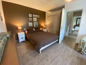 Postel nebo postele na pokoji v ubytování Moulin du pont neuf Maison des Meuniers