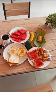 two plates of breakfast food on a table at Connexion in Ko Yao Noi