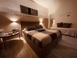Säng eller sängar i ett rum på La piazzetta