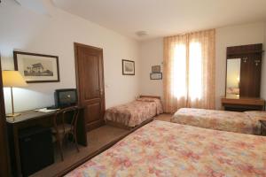Postel nebo postele na pokoji v ubytování Villa Nencini
