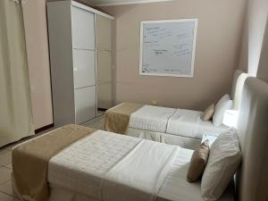 Ein Bett oder Betten in einem Zimmer der Unterkunft Las Arecas - rucci 61