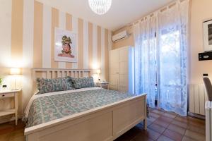 Postel nebo postele na pokoji v ubytování B&B Le Sorelle