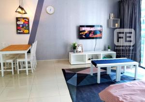 a living room with a table and a dining room at Netflix Wifi Trefoil Homestay Setia Alam SACC Homestay FE in Shah Alam