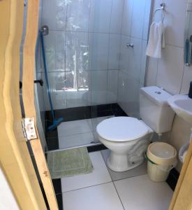a bathroom with a toilet and a shower at casa pedacinho do morro in Bom Jesus da Lapa